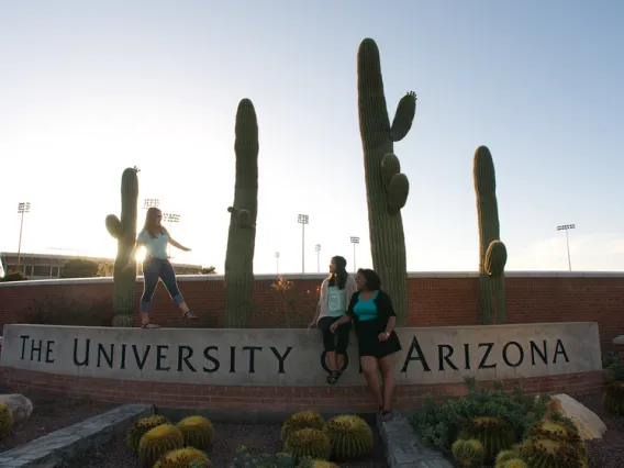 Students at stone landmark