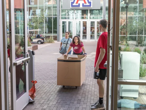 student and parent moving in at Honors Village dorm