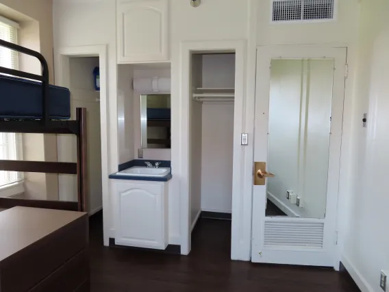 Sink and closets in single dorm room in Maricopa