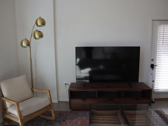 living room featuring television and console 