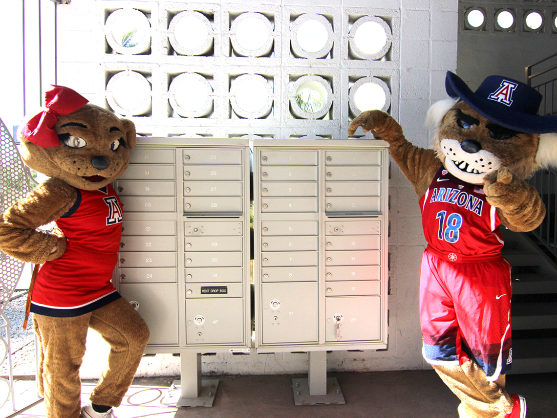 Wilbur and Wilma standing next to mailboxes