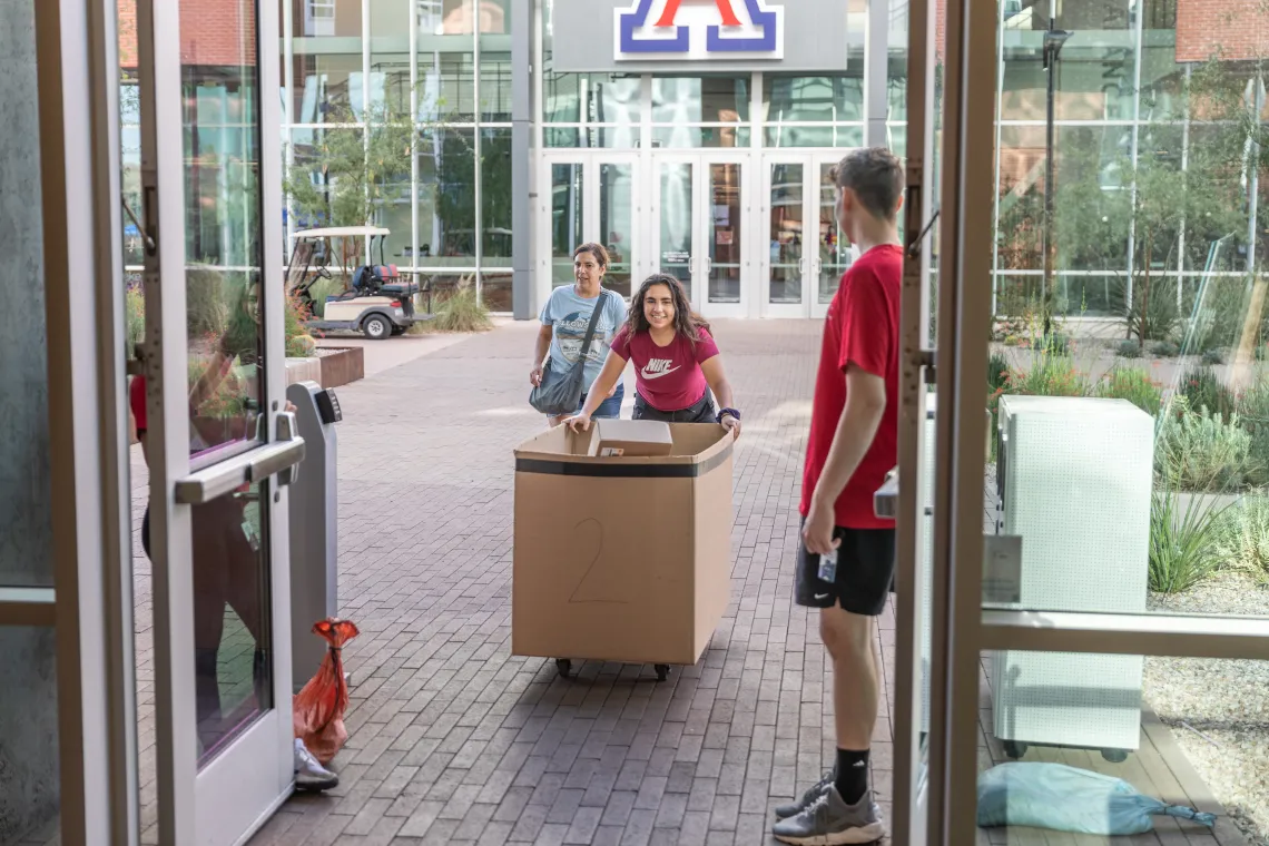 student and parent moving in at Honors Village dorm