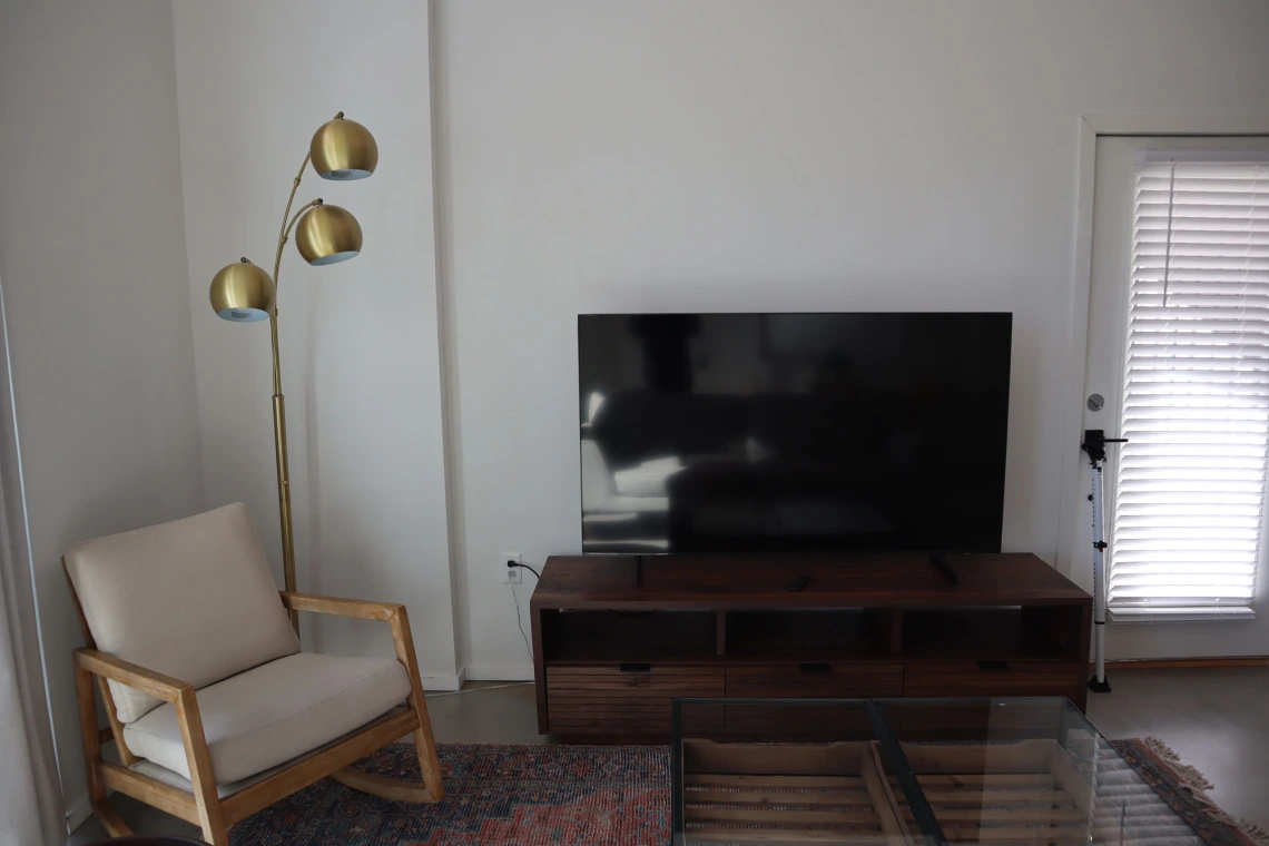 living room featuring television and console 