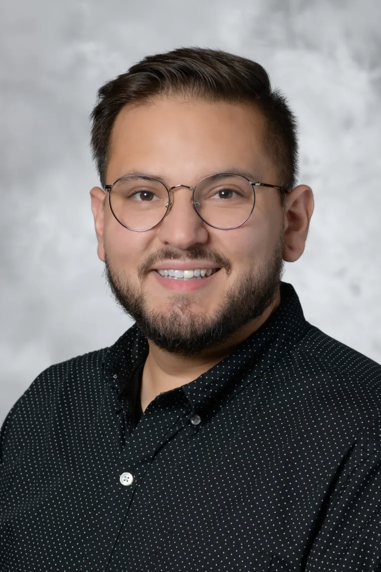 headshot of manny